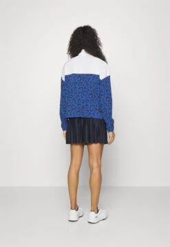 PUMA Golf Hoops Golf Jacket - Windjack - Clyde Royal/White Glow -Golfserie Winkel 82cf58e104184e28a66080bffde5bc47